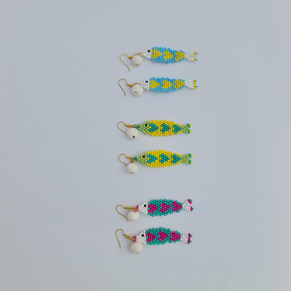 Set of colorful beaded earrings on a light gray background