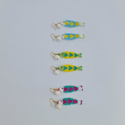 Set of colorful beaded earrings on a light gray background