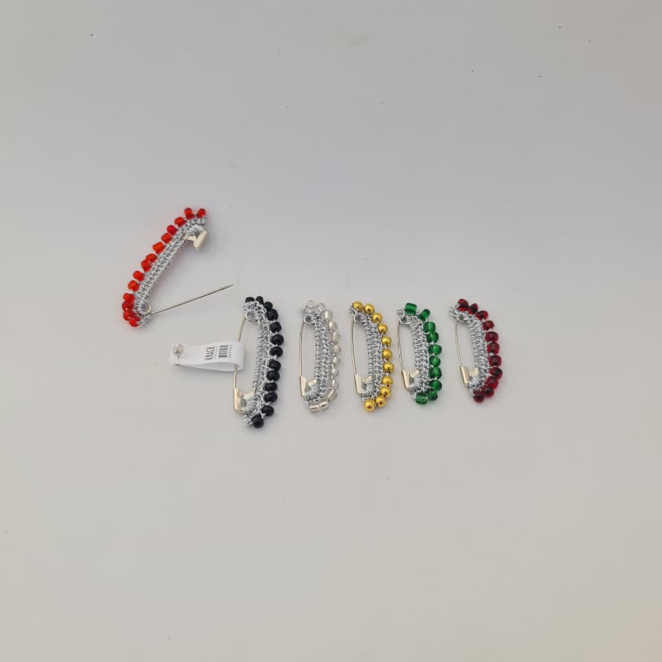 Set of colorful hair clips on a light gray background